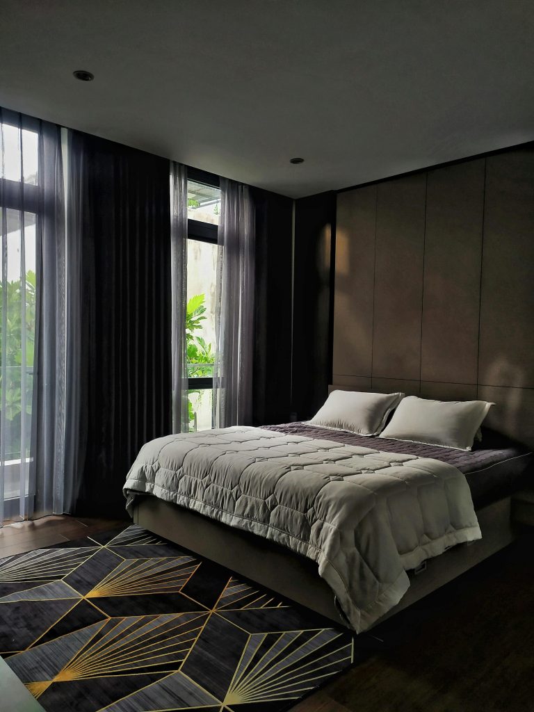 Elegant hotel room with double bed and contemporary decor in Sơn Trà, Đà Nẵng, Vietnam.